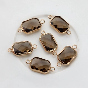 Detailed set of six smoky crystal rectangular faceted pendants with gold-plated copper edges