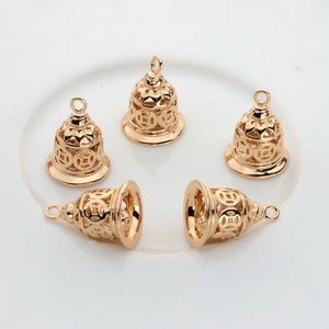 Five hollow gold-plated bell pendants with traditional coin patterns for DIY jewelry making