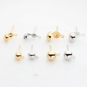Detail of 14K gold-plated half-ball earring studs with hanging loops for jewelry making