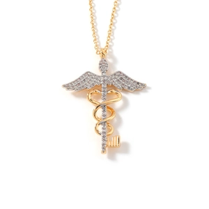 Detailed view of the dual-tone caduceus key pendant with sparkling crystal inlay