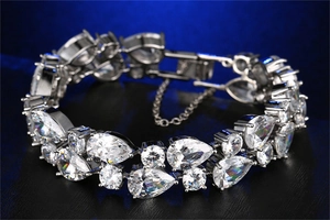 Macro shot of luxury bracelet featuring pear-cut cubic zirconia and a secure folding clasp
