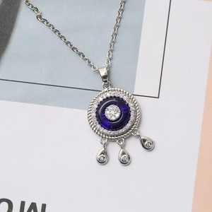 Turkish Evil Eye necklace with blue glass stone and sparkling zircon accents in silver