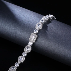 Silver tennis bracelet with mixed-cut zirconia stones in pear and heart shapes