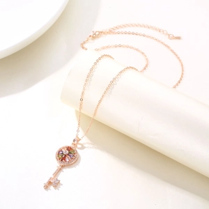 Rose gold key pendant necklace with colorful gemstones and sparkling zircons