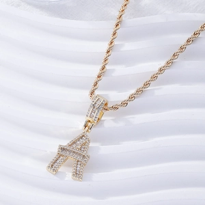 Icy gold letter A pendant necklace with square zirconia and a classic rope chain