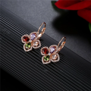 Macro view of colorful floral drop earrings with rose gold plating and zircon petals
