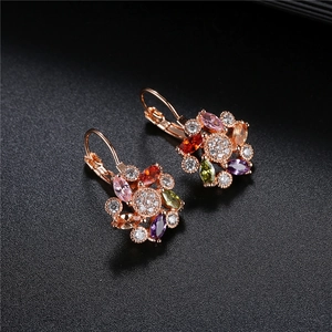 Macro shot of colorful floral earrings with vibrant zircon stones and lever-back closure