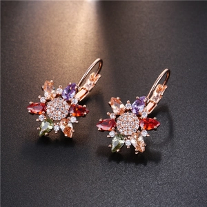 Floral earrings in rose gold with colorful drop-shaped zirconia crystals on dark background