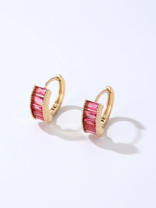 Detail of gold hoop earrings featuring five rectangular pink zircon stones with side engraving