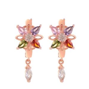 Colorful floral drop earrings with vibrant zircons and rose gold finish on white background