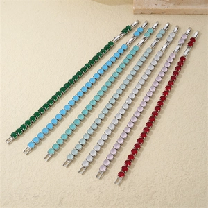 Detailed view of colorful zircon tennis bracelets in a set of seven vibrant shades