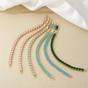 Set of six gold tennis bracelets featuring round-cut colored cubic zirconia crystals