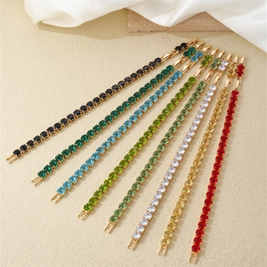 Detailed row of gold-plated tennis bracelets with colorful square-cut zircon stones