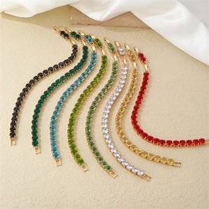 Macro shot of colorful tennis bracelets with micro-pave zircons and gold plated link chains