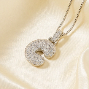 Hip hop cubic zirconia letter C pendant necklace with box chain on silk background