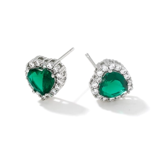 Elegant silver heart earrings with green emerald zircon and sparkling halo on white base