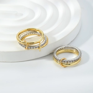 Eleganti anelli tripli intrecciati bicolore con pavé di zirconi in oro e argento