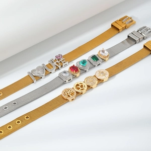 Detail of adjustable mesh bracelets with gold and silver finishes and crystal charms