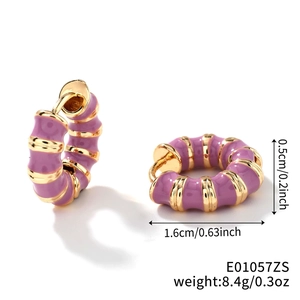 Vintage gold hoop earrings with light purple enamel stripes in a bamboo texture design