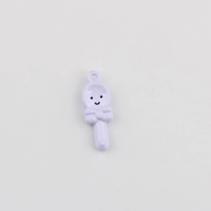 Detail of light purple spoon pendant with cute smiley face and bow for DIY jewelry making