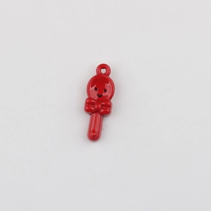 Detail of red lollipop alloy pendant with smiley face and bow for DIY jewelry making