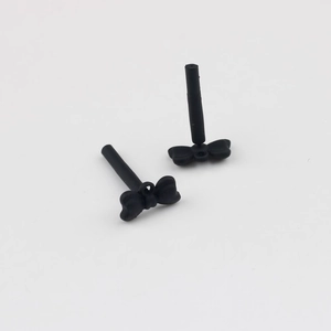 Macro detail of matte black bow straw topper attachment for DIY accessory design