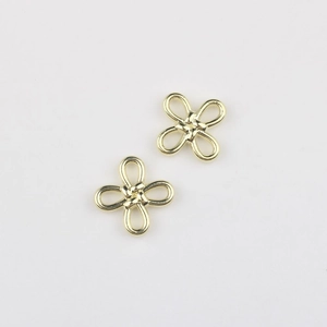 Detail of golden flower knot alloy pendants for DIY jewelry making accessories