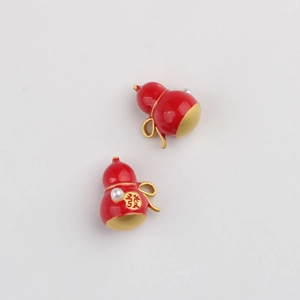 Detail of red gourd charms with gold bow, white pearl, and Chinese prosperity character