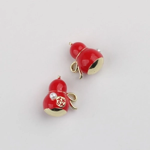 Detail of red gourd pendant with gold character and pearl for jewelry making