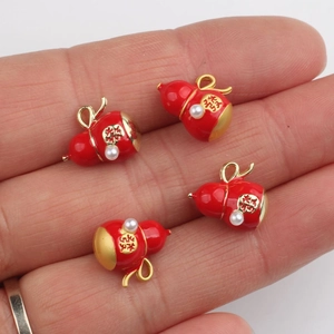 Red gourd charm with gold calligraphy and pearl inlay for DIY jewelry crafting