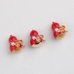 Golden Wu Lou gourd charms with red enamel, pearl inlay and lucky character engraving