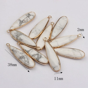 Set of eight 38mm natural agate teardrop pendants with gold plated edges on white background