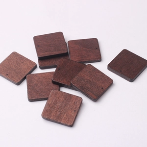 Close-up of 27mm square walnut wood beads with wood grain texture and pre-drilled holes