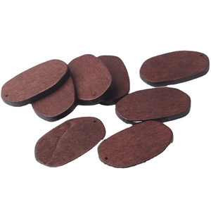 Oval walnut wood charms with double holes for DIY jewelry making on white background
