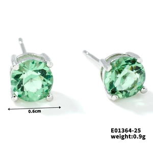 Minimalist green glass stud earrings with round cut and silver claw setting