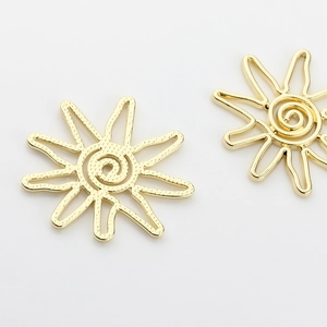 Abstract sun-shaped gold metal jewelry pendants with spiral center and wavy rays