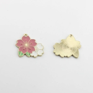 Close-up of double-colored cherry blossom charms with enamel oil drip and gold plating