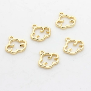 Five pieces of gold hollow cloud pendants for DIY jewelry making on white background