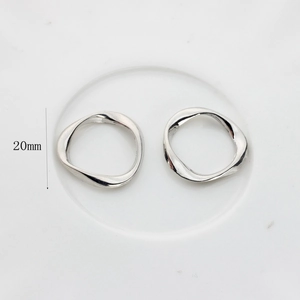 Detail view of 20mm irregular wave silver alloy circle pendant for DIY jewelry making