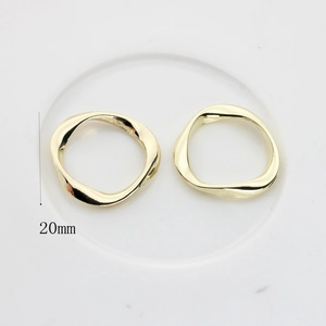 Detail view of 20mm irregular gold wavy alloy ring pendants for DIY earring jewelry making