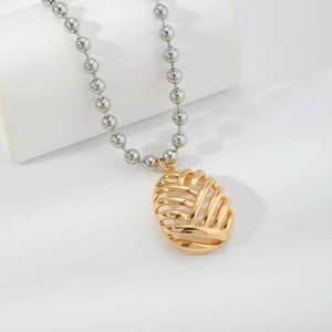 Collana con ciondolo a gabbia dorata e catena a sfere d'argento per regalo di coppia