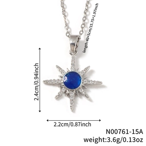Eight-pointed star pendant necklace with deep blue sparkling center and crystal stones