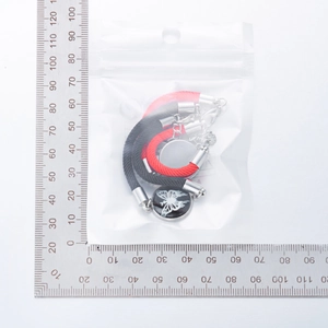 Close-up of sun and moon woven bracelets in clear packaging showing precise measurements