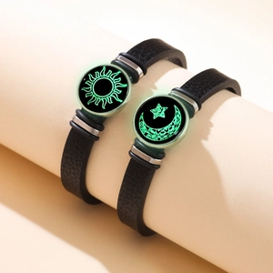 Luminous sun and moon couple bracelets with black leather straps and silver metal charms