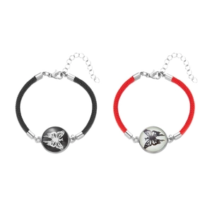 Matching sun and moon woven bracelets for couples with butterfly charms and steel clasps