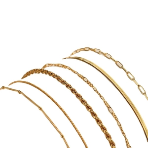 Set of six gold minimalist chain bracelets featuring snake, cable, and paperclip links