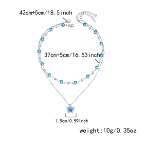 Detail of silver double-layered butterfly necklace showing specific chain lengths and weight