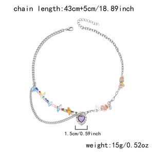 Detail of silver-tone beaded chain with vintage engraved purple heart pendant necklace