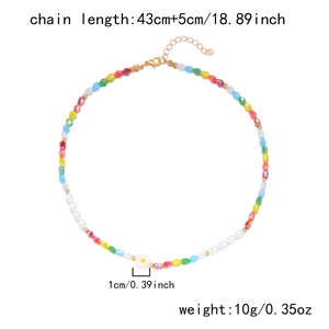 Detail view of colorful bead necklace with daisy charm and length measurements shown