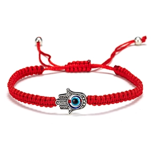 Adjustable red braided Evil Eye bracelet with Hamsa Hand charm and blue stone inlay